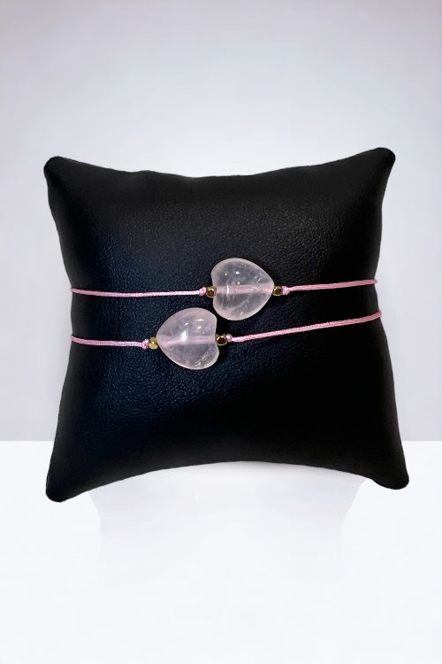 At its heart lies a gentle Rose Quartz stone, known as the stone of unconditional love, paired seamlessly with the subtle shimmer of gold hematite beads. This combination not only radiates warmth and compassion but also brings a sense of calm and balance.