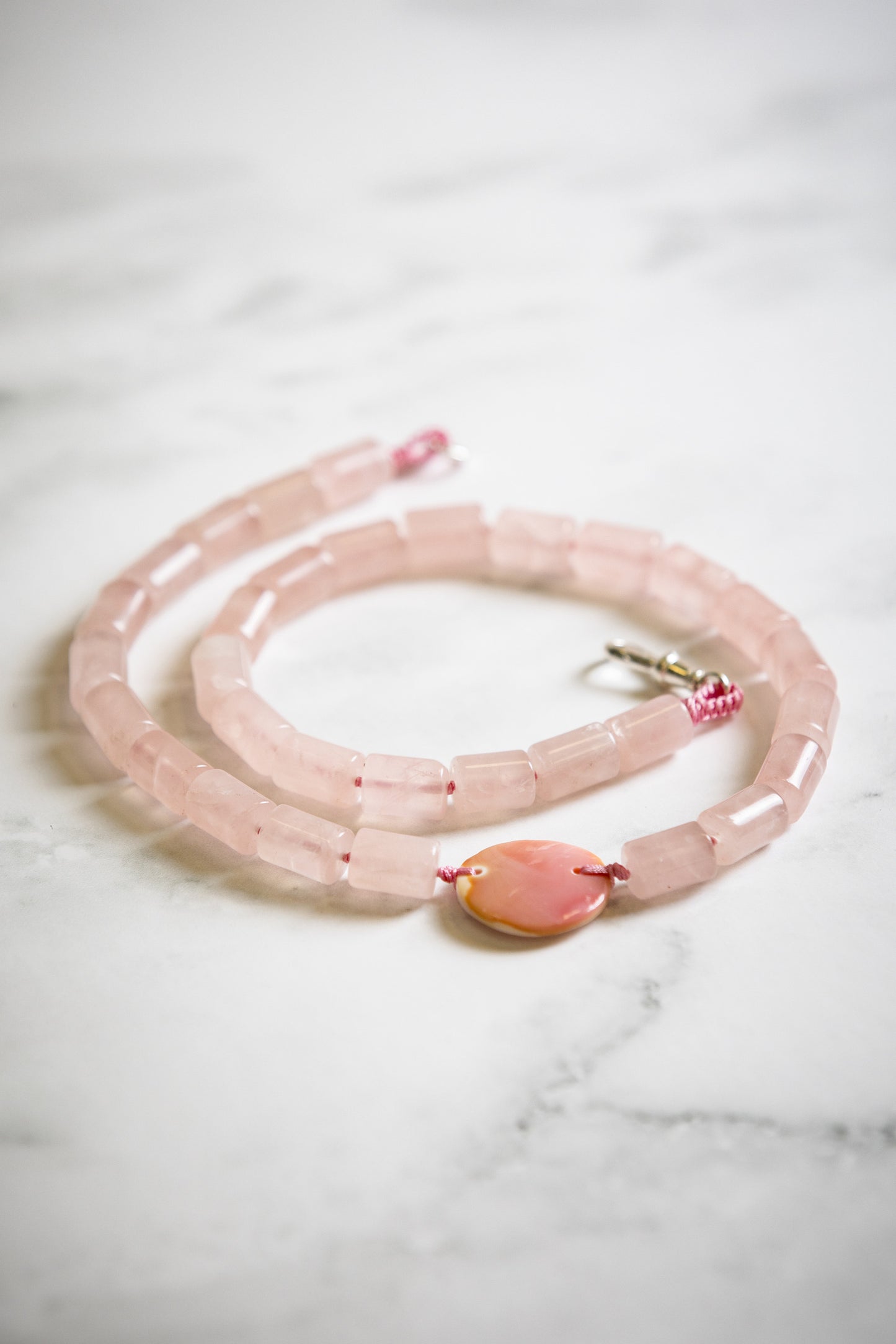 Rose Quartz Cylinder with Hand Carved Conch Shell Coin Necklace