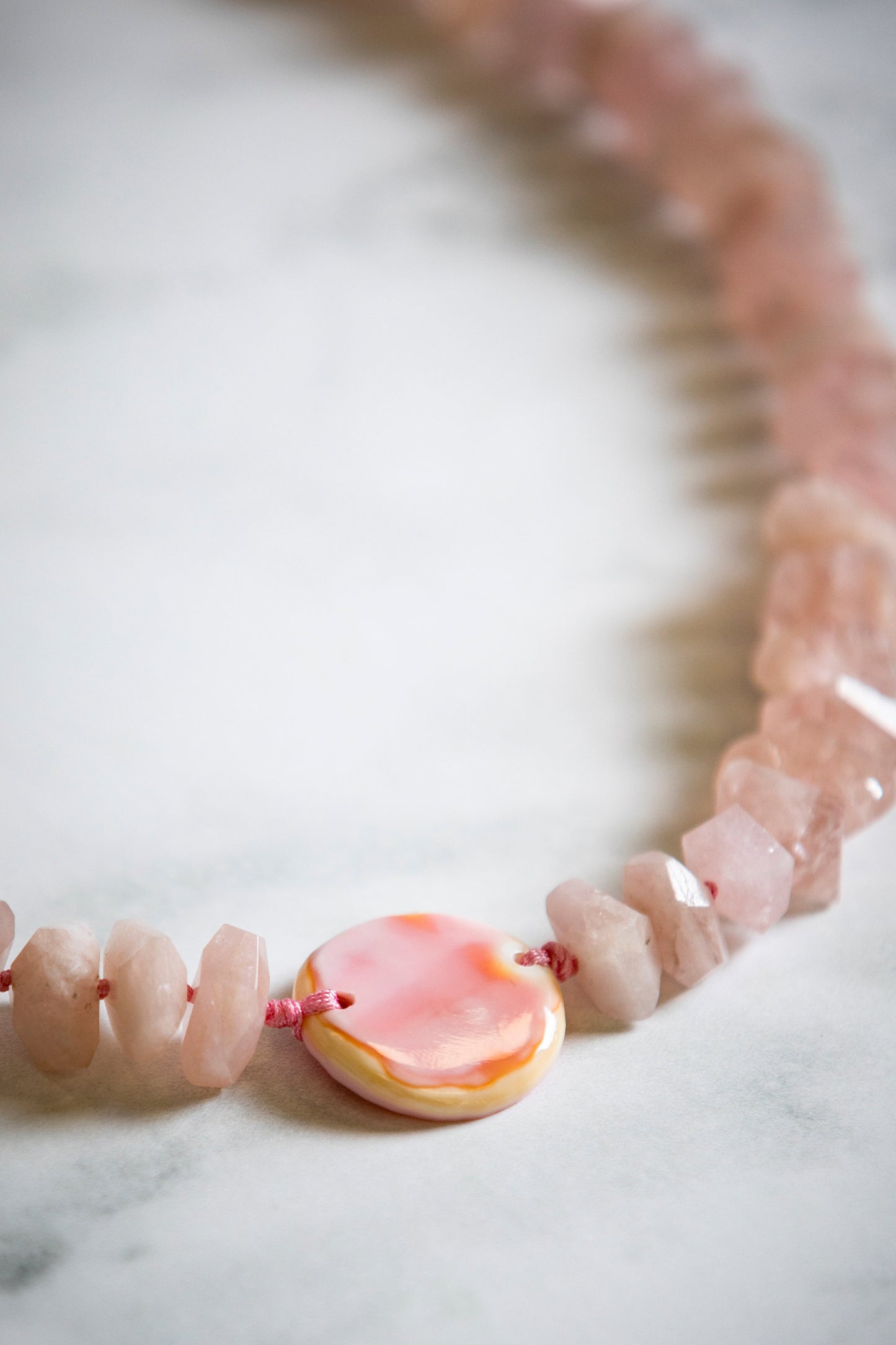 Faceted Pink Morganite with Hand Carved Conch Shell Coin